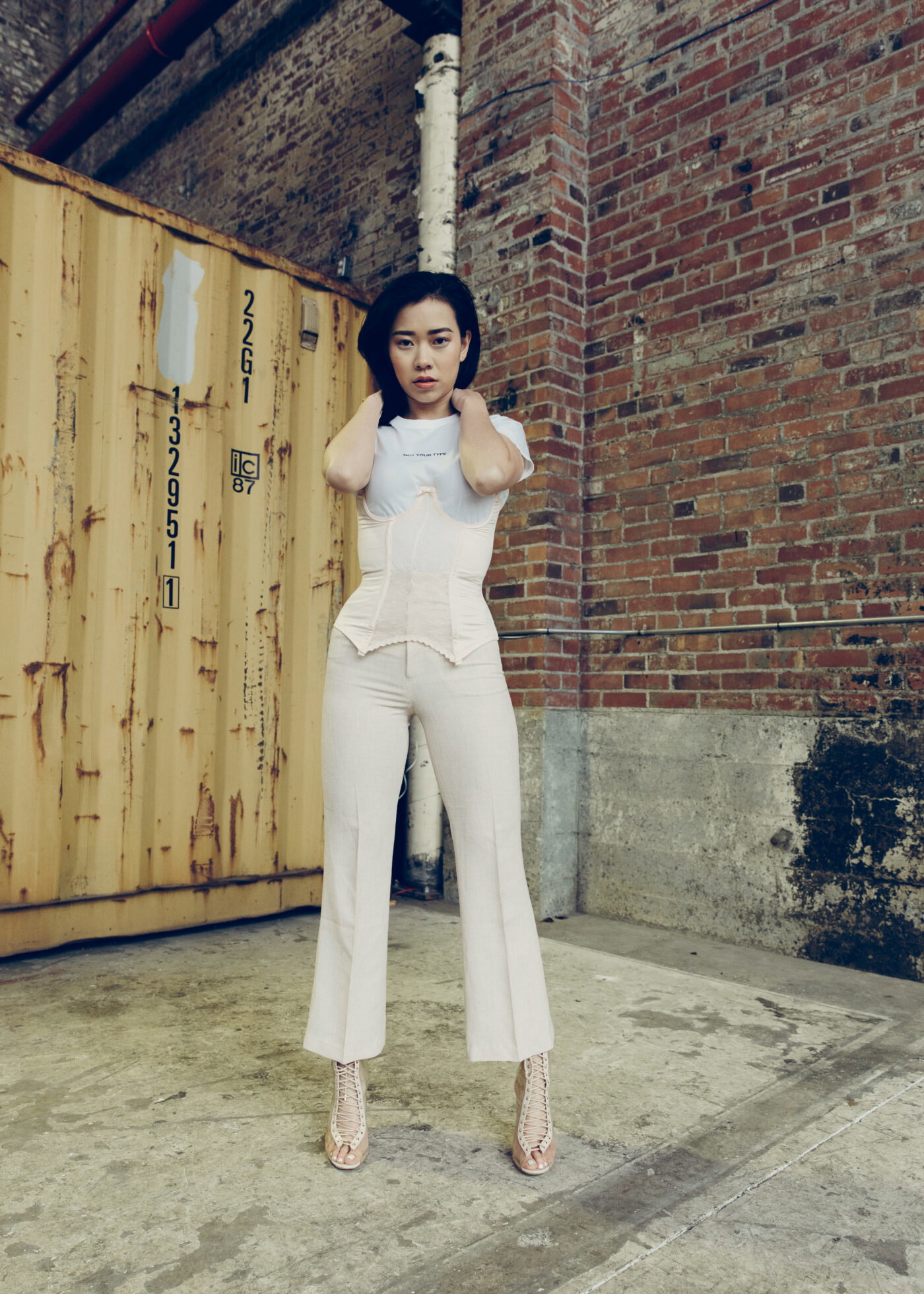 Louisa Meng in her NYT pink cutout corset and pink tweed trouser.