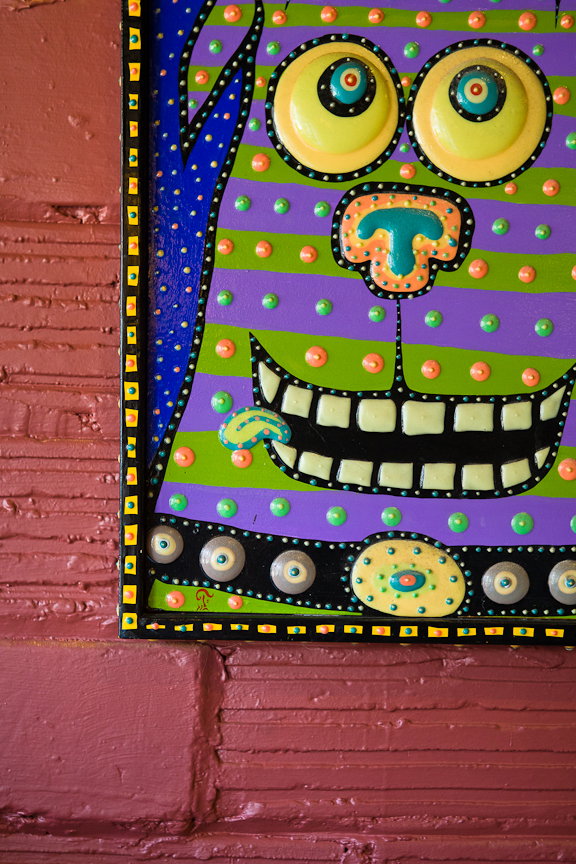 Friend Glenn Fox designed the eclectic artwork (parts of which glow in the dark) seen throughout.