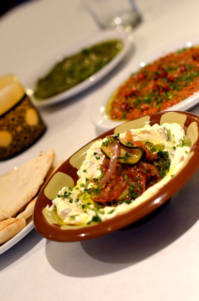 Batinjan Josephine takes center stage, thick, creamy yogurt topped with roasted vegetable and bright parsley and olive oil.