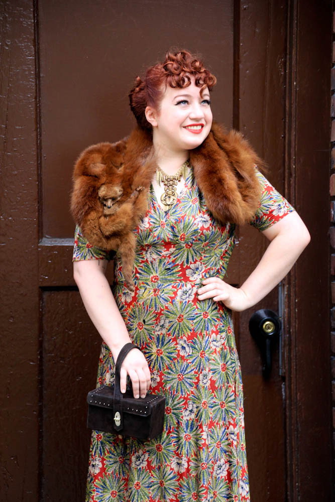 Sara Wood sports a fur stole in the middle of muggy Seattle summer weather with elegance and grace.