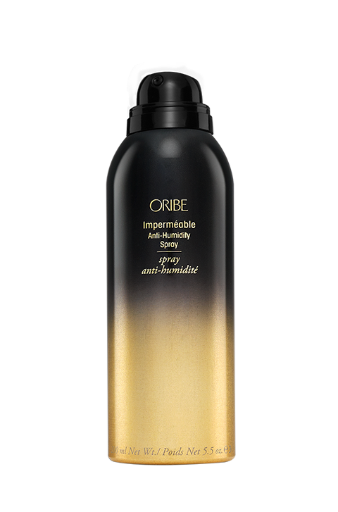 Fight the humidity with messy beach waves. Keep your curling iron vertical as you curl large sections of hair. Curl away from your face while leaving the ends out. Run your fingers through the curls, then spray with Imperméable Anti-Humidity Spray by Oribe, which is French for "raincoat," to keep the curls form getting frizzy throughout the day. SOURCE: Oribe