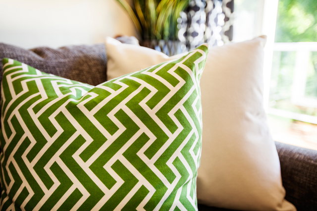 Eclectic pillows add unique personality to the room.