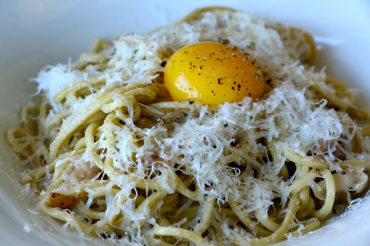 A roman-style spaghetti with guanciale, black pepper, pecorino, and egg yolk. Before...